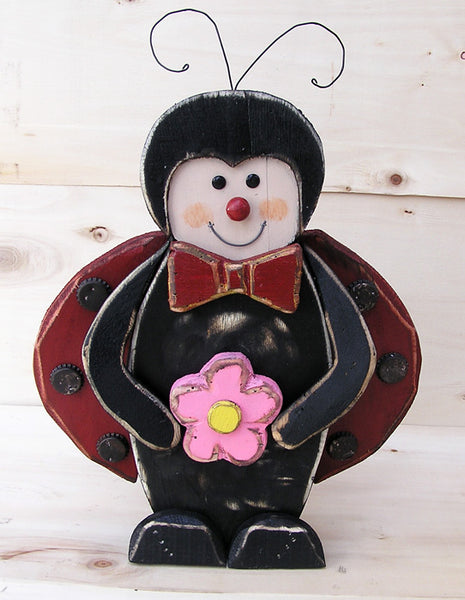 Wooden Ladybug Holding  Flower