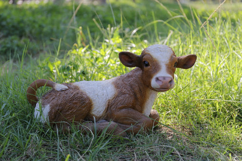 Brown and White Lying Down Cow Statue